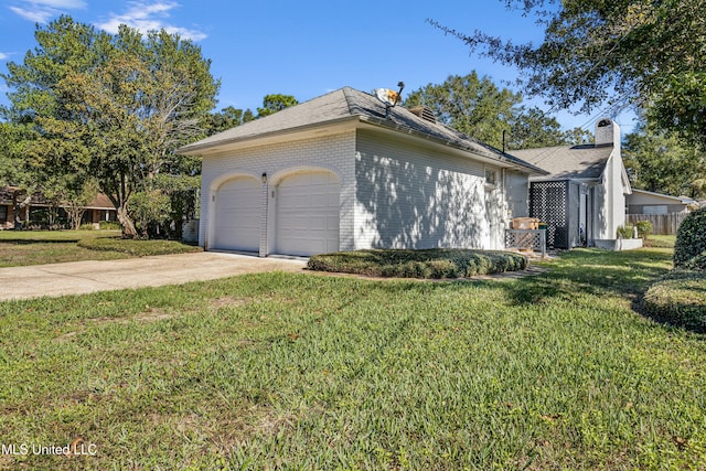 view of side of property with a lawn