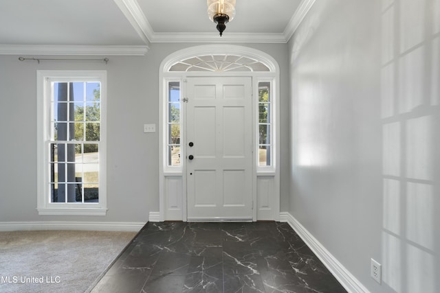 foyer featuring crown molding