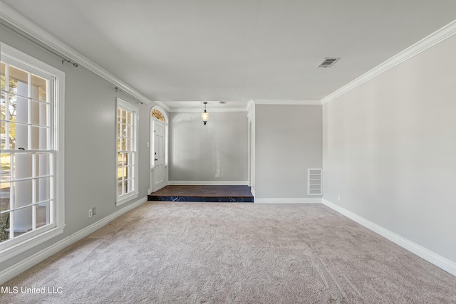 unfurnished room featuring carpet flooring and ornamental molding