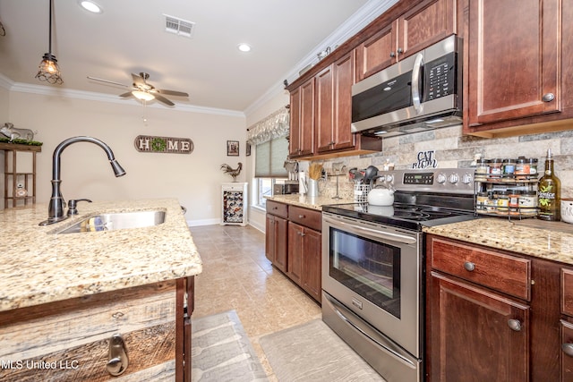 kitchen with crown molding, sink, ceiling fan, appliances with stainless steel finishes, and decorative light fixtures