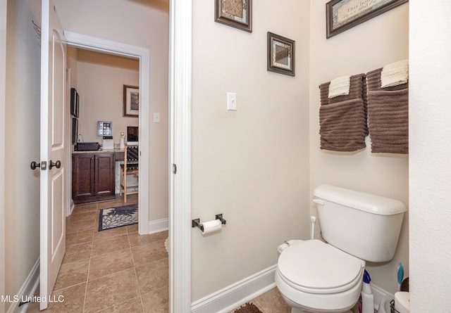 bathroom featuring tile patterned floors and toilet