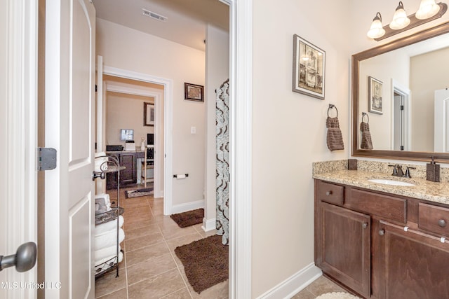 bathroom featuring tile patterned floors, vanity, and a shower with shower curtain