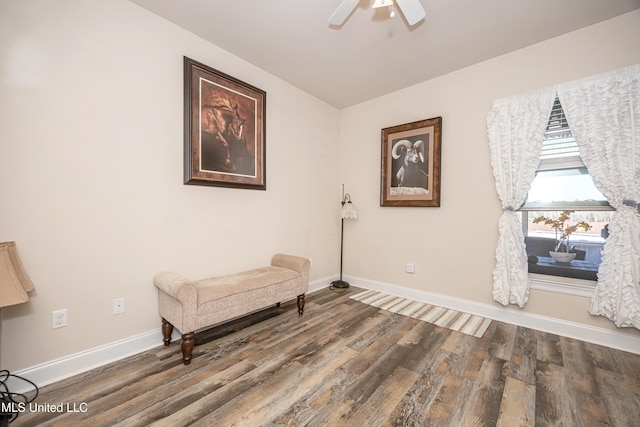 living area with ceiling fan and hardwood / wood-style flooring