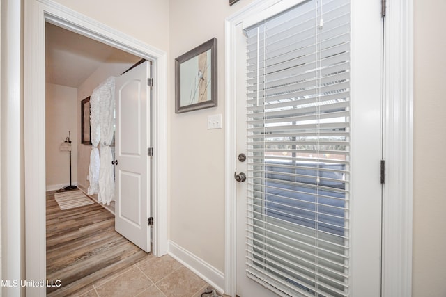 entryway featuring light tile patterned floors