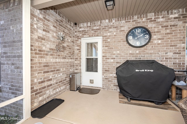 view of patio featuring a grill