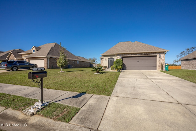 view of front of home featuring a front lawn and a garage