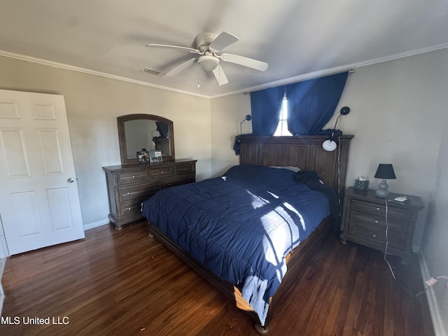 bedroom featuring visible vents, crown molding, baseboards, ceiling fan, and wood finished floors