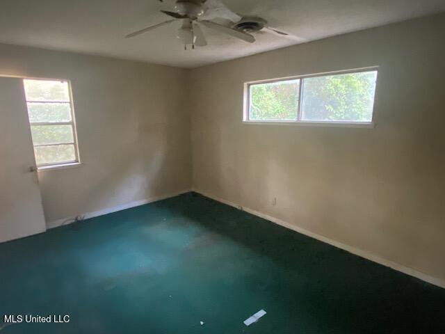 511 Forest Ave, Jackson, MS 39206 - spare room featuring healthy amount of natural light, ceiling fan, and baseboards
