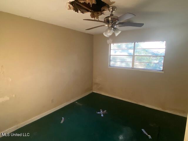 511 Forest Ave, Jackson, MS 39206 - spare room featuring baseboards and a ceiling fan