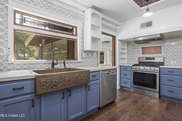 208 Washington Ave, Ocean Springs, MS 39564 - kitchen featuring appliances with stainless steel finishes, blue cabinets, a sink, and ornamental molding