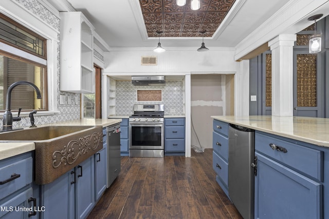 208 Washington Ave, Ocean Springs, MS 39564 - kitchen featuring blue cabinets, stainless steel appliances, dark wood-type flooring, an ornate ceiling, and tasteful backsplash