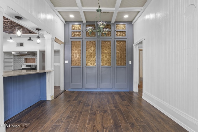 208 Washington Ave, Ocean Springs, MS 39564 - unfurnished living room featuring hardwood / wood-style flooring, beamed ceiling, and coffered ceiling