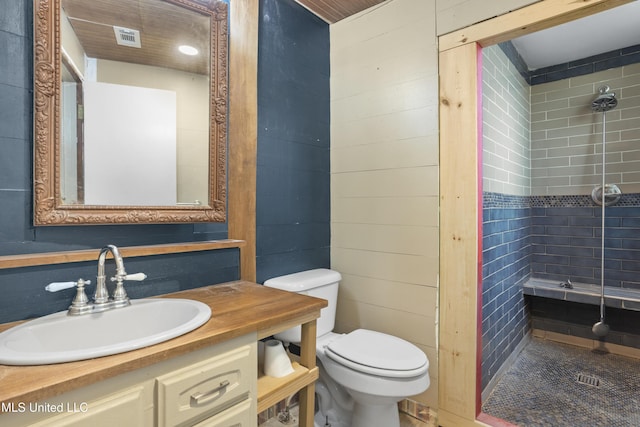 208 Washington Ave, Ocean Springs, MS 39564 - full bathroom with toilet, tiled shower, and vanity