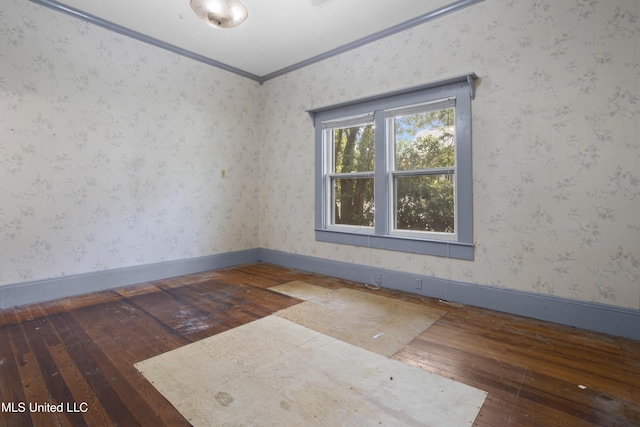 208 Washington Ave, Ocean Springs, MS 39564 - empty room with hardwood / wood-style flooring, crown molding, baseboards, and wallpapered walls