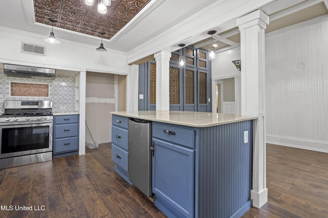 208 Washington Ave, Ocean Springs, MS 39564 - kitchen featuring stainless steel gas range, blue cabinets, under cabinet range hood, ornate columns, and an ornate ceiling