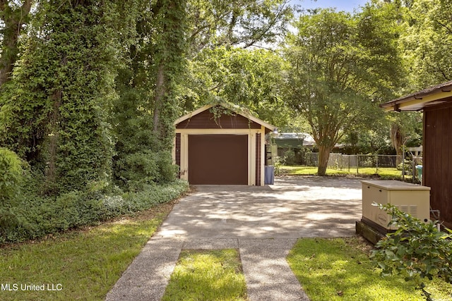 208 Washington Ave, Ocean Springs, MS 39564 - detached garage featuring asphalt driveway