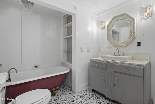 208 Washington Ave, Ocean Springs, MS 39564 - full bathroom featuring vanity, a freestanding bath, tile patterned flooring, and toilet