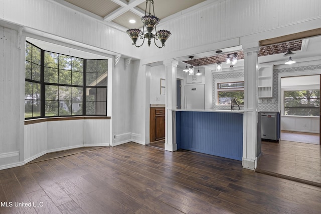 208 Washington Ave, Ocean Springs, MS 39564 - kitchen with decorative columns, dishwasher, dark wood-style flooring, white fridge, and a chandelier
