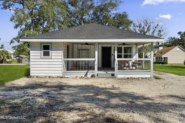 bungalow with ceiling fan, a front yard, and a porch