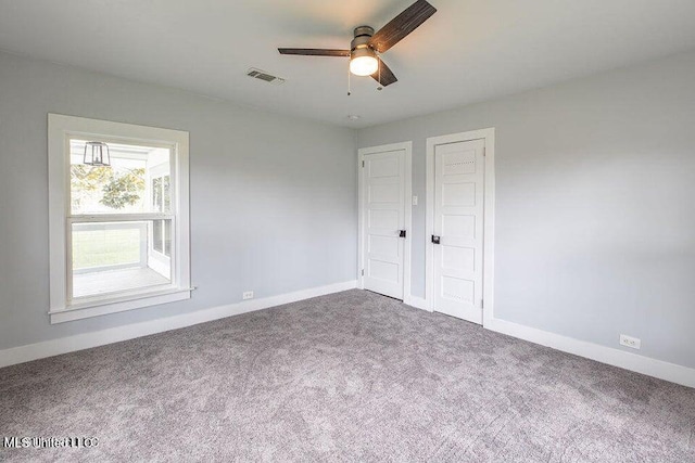 unfurnished bedroom featuring carpet floors and ceiling fan