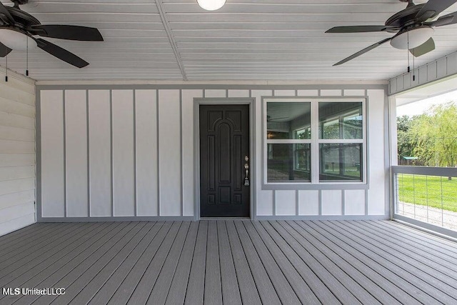 wooden deck featuring ceiling fan