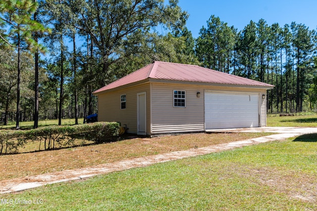 garage with a lawn