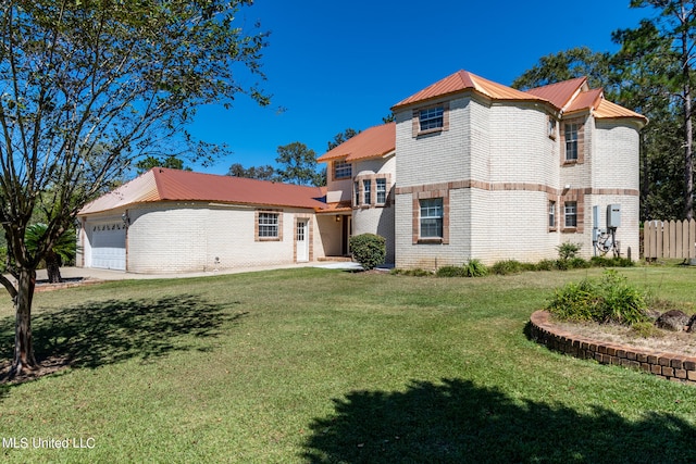 view of front facade featuring a front lawn and a garage