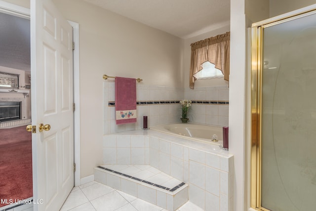 bathroom with separate shower and tub, a textured ceiling, and tile patterned floors