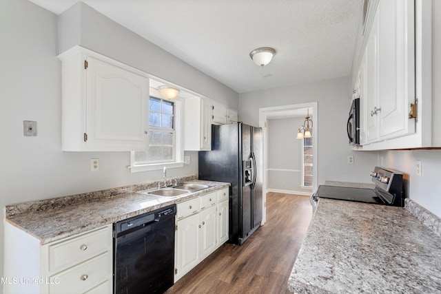 kitchen featuring sink, white cabinets, dark hardwood / wood-style floors, and black appliances