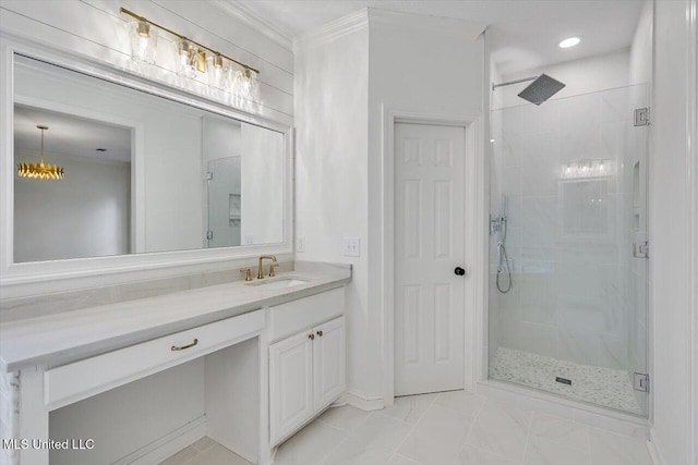 bathroom with ornamental molding, vanity, and a shower with shower door