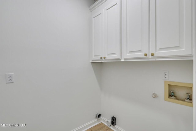 clothes washing area featuring cabinets, hookup for a washing machine, hookup for an electric dryer, and hookup for a gas dryer