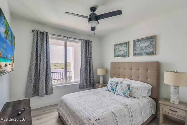 bedroom with light wood-type flooring and ceiling fan