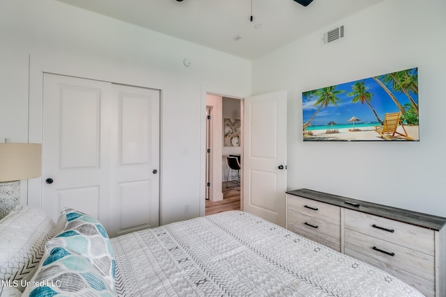 bedroom featuring wood-type flooring and a closet