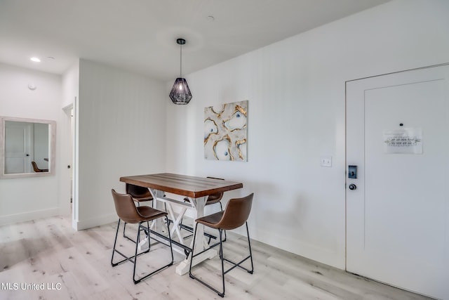 dining area featuring light wood-type flooring