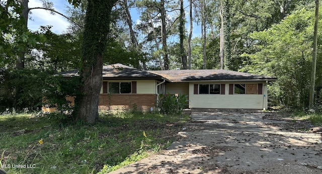 3033 Grey Blvd, Jackson, MS 39212 - view of front of house featuring driveway and brick siding