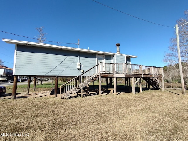 rear view of property with a wooden deck