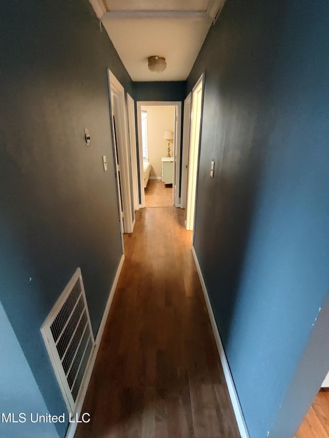 hallway featuring wood-type flooring