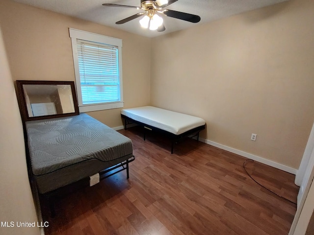 bedroom featuring ceiling fan and hardwood / wood-style floors