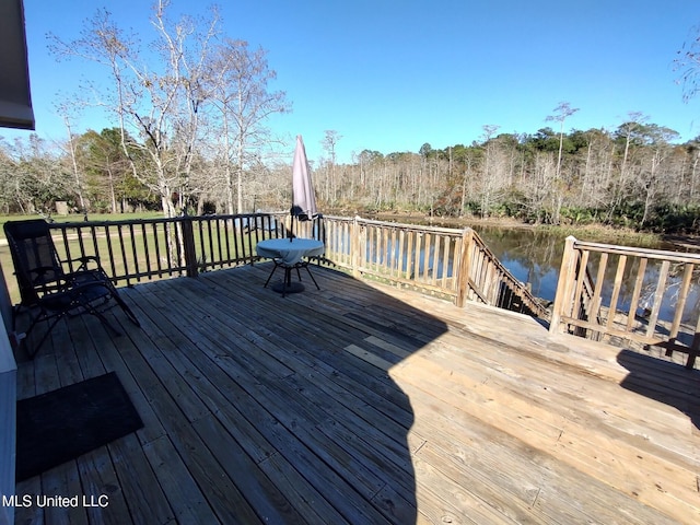 wooden deck featuring a water view