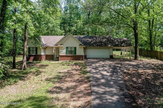 7488 Hickory Estates Dr, Walls, MS 38680 - ranch-style home featuring fence, a garage, brick siding, and aphalt driveway