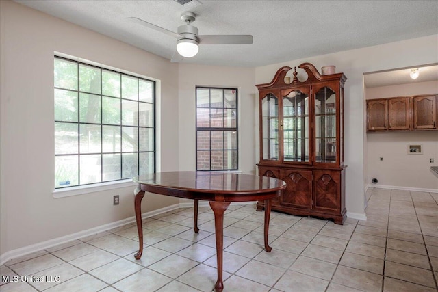 7488 Hickory Estates Dr, Walls, MS 38680 - dining room with a healthy amount of sunlight, light tile patterned floors, ceiling fan, and a textured ceiling