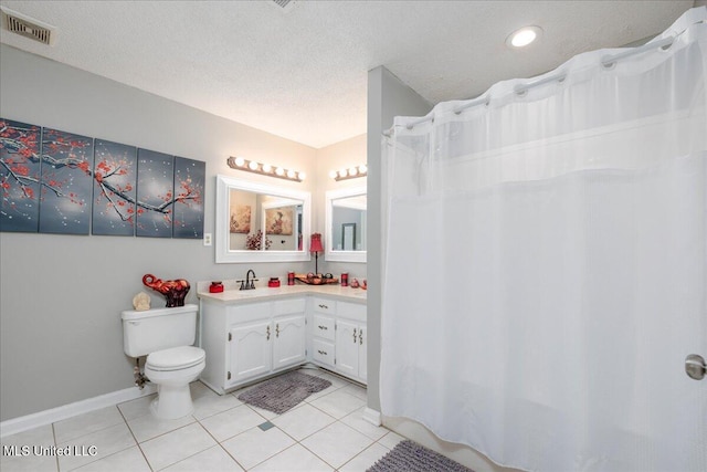 7488 Hickory Estates Dr, Walls, MS 38680 - full bath featuring visible vents, tile patterned flooring, baseboards, vanity, and toilet