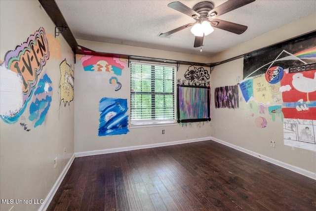 7488 Hickory Estates Dr, Walls, MS 38680 - spare room with baseboards, a ceiling fan, a textured ceiling, and hardwood / wood-style floors
