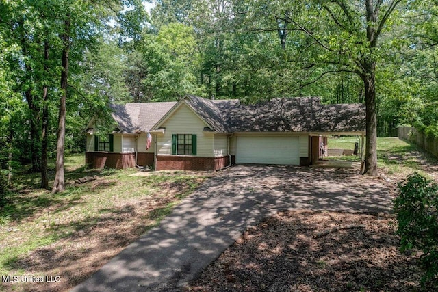 7488 Hickory Estates Dr, Walls, MS 38680 - ranch-style home with fence, an attached garage, driveway, and brick siding
