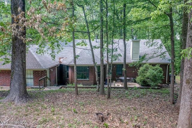 7488 Hickory Estates Dr, Walls, MS 38680 - view of front of house with brick siding, a shingled roof, and a patio