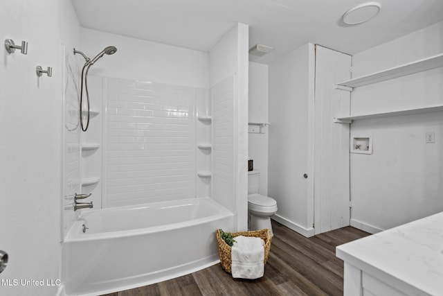 bathroom featuring shower / bath combination, visible vents, toilet, vanity, and wood finished floors