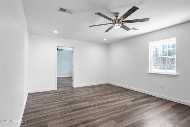 unfurnished room with recessed lighting, a ceiling fan, visible vents, baseboards, and dark wood finished floors