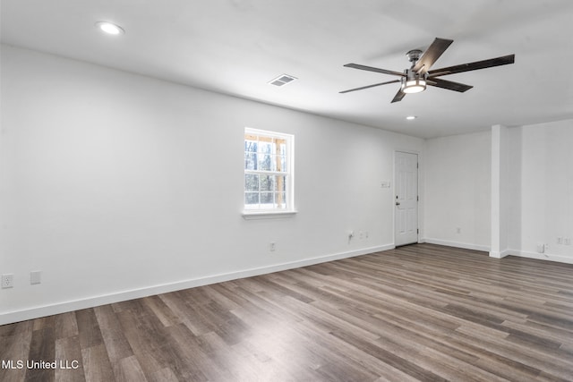 unfurnished room with visible vents, baseboards, ceiling fan, wood finished floors, and recessed lighting