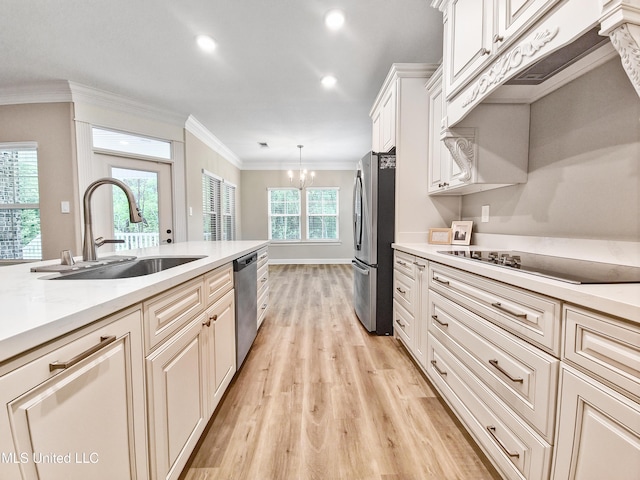 16814 W Landon Green Dr, Gulfport, MS 39503 - kitchen featuring stainless steel appliances, light wood-style flooring, a chandelier, crown molding, and decorative light fixtures
