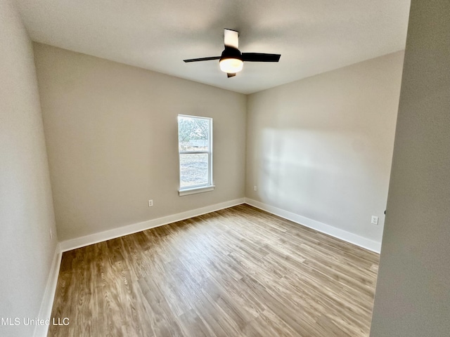 unfurnished room with ceiling fan and light hardwood / wood-style flooring